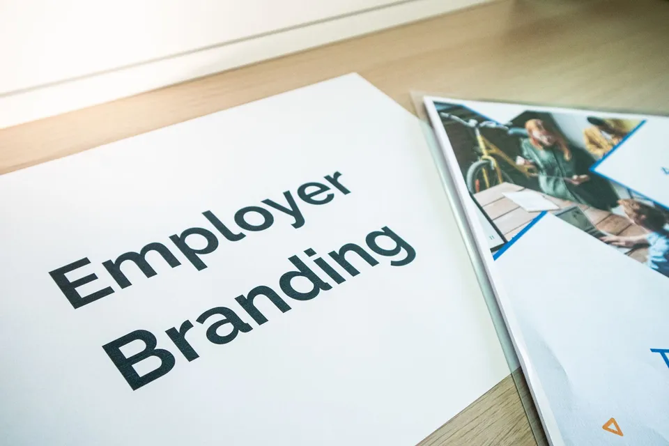 Brand identity materials laid out on a desk for a consistency review