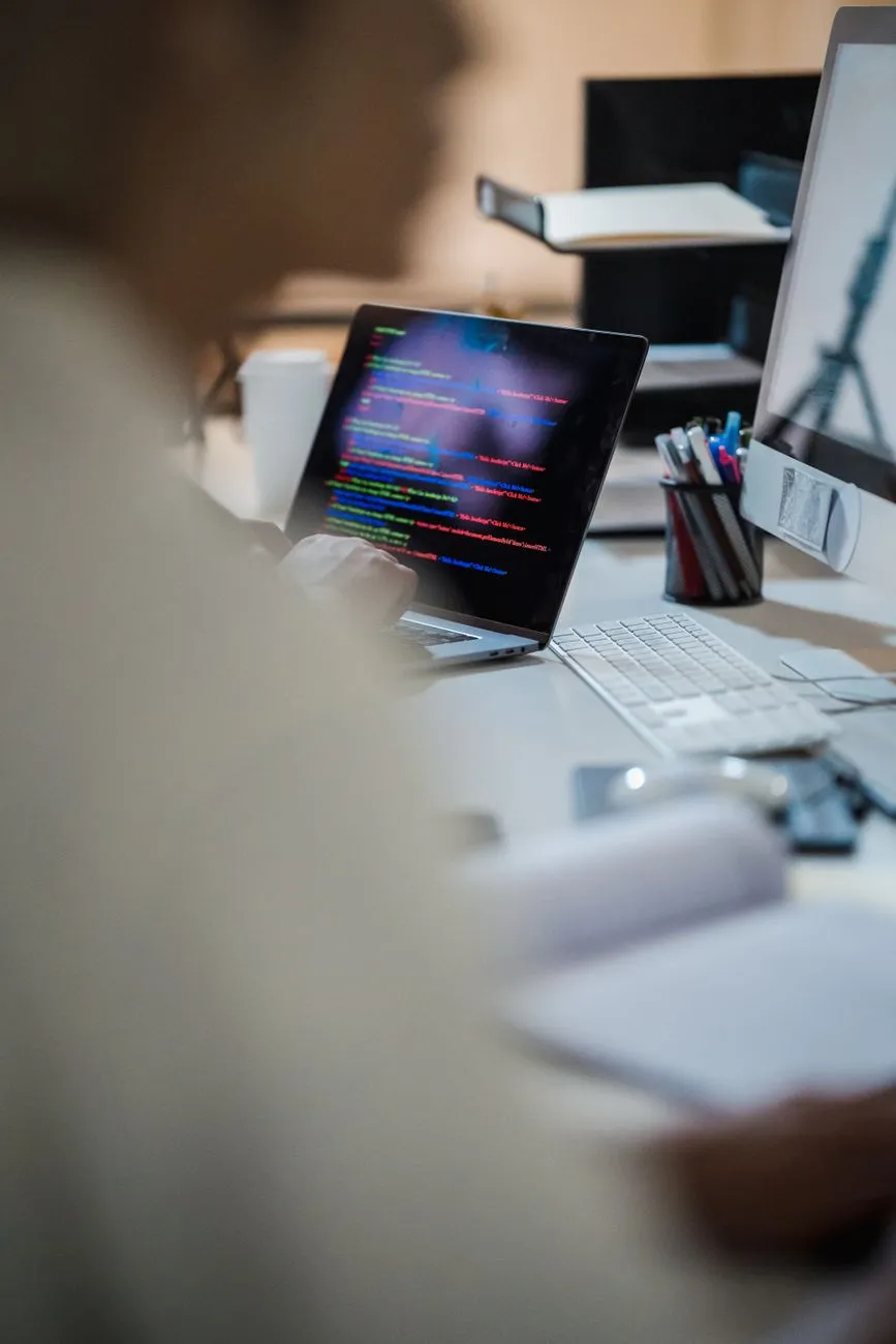 A developer writing frontend code during a WordPress to Astro migration audit