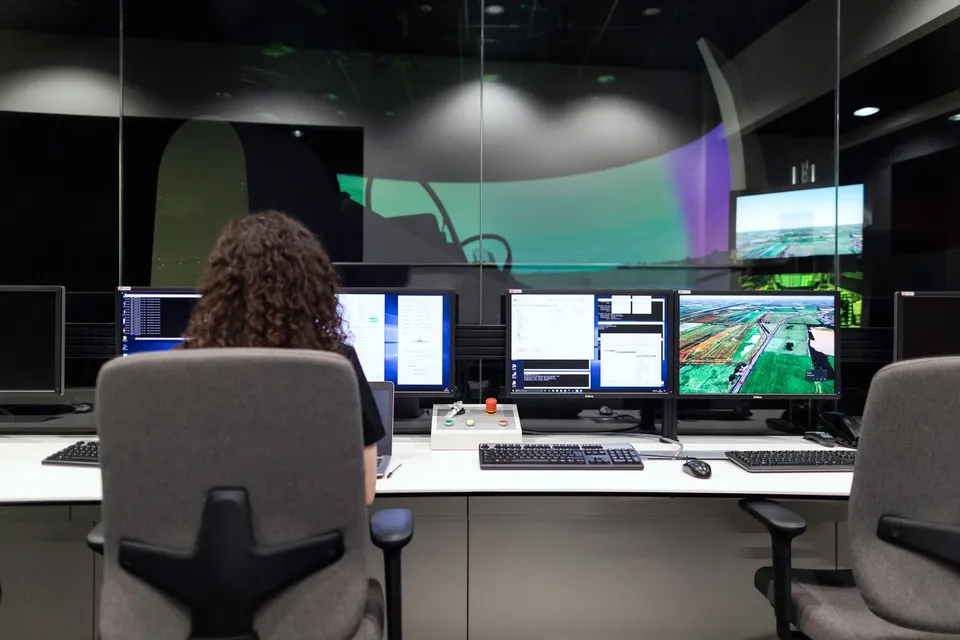 An engineer monitoring a website's uptime and update status across multiple dashboard screens